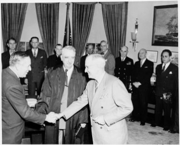 Paul Hoffman is sworn in as administrator of the European Recovery Corporation by Chief Justice Fred Vinson in the... - NARA - 199760 photo