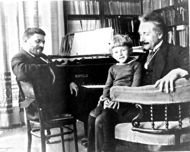 Paul Ehrenfest on the Hupfeld grand piano with Paul junior and Albert Einstein, Leiden, 1920 photo