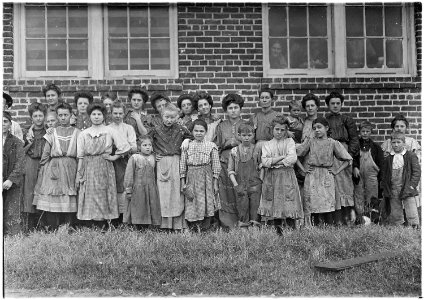 Payne Cotton Mill. Girl with drooping eyes and hands on hips has been helping one year. Macon, Ga. - NARA - 523156