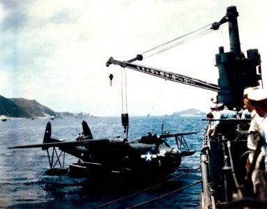 PBM-5 VPB-26 being hoisted on USS Norton Sound (AV-11) Okinawa 1945