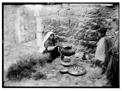 Peasant types. Cooking in a peasant home. (Pottery cooking pot and thorn fire) LOC matpc.05924
