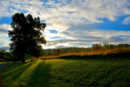 Sunlight clouds field photo