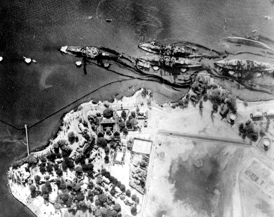 Pearl harbor Battleship row after the attack high level aerial view 80G387565