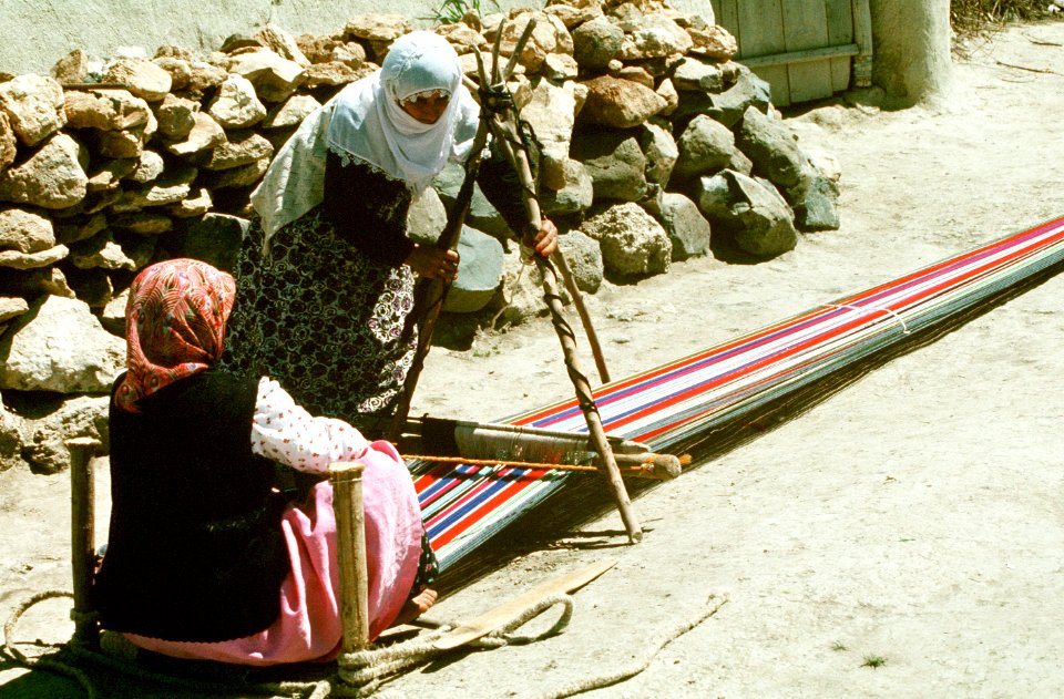 Peasant women weave brightly colored wool in a village between Gaziantep and Diyarbakir DN-ST-91-10663