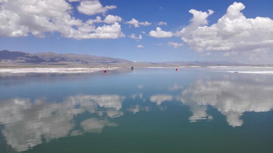 Caka salt lake snow mountain white cloud photo