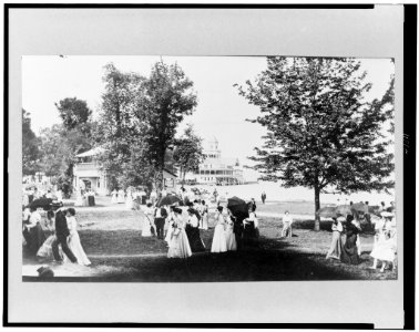 People socializing at Chautauqua, New York, with Lake Chautauqua in background LCCN95515745 photo