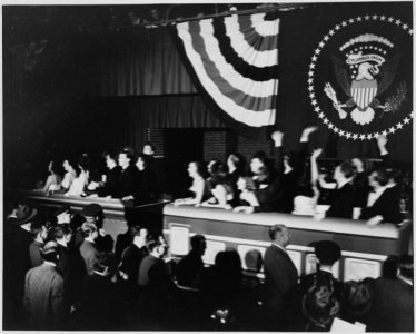 Performers ride in to President Truman's inaugural gala in a miniature train. The gala was held at the National Guard... - NARA - 199990 photo