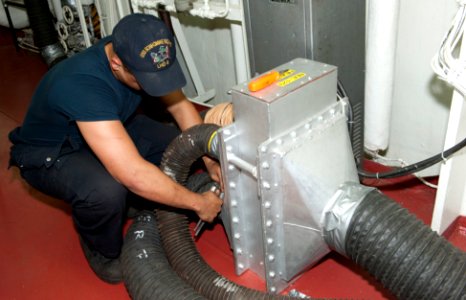 Performing maintenance 120718-N-VA915-007