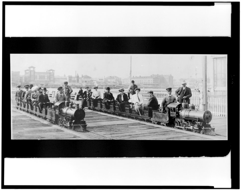 People on two miniature railroad trains on bridge or pier, possibly at Dreamland, Coney Island, New York City LCCN96510269