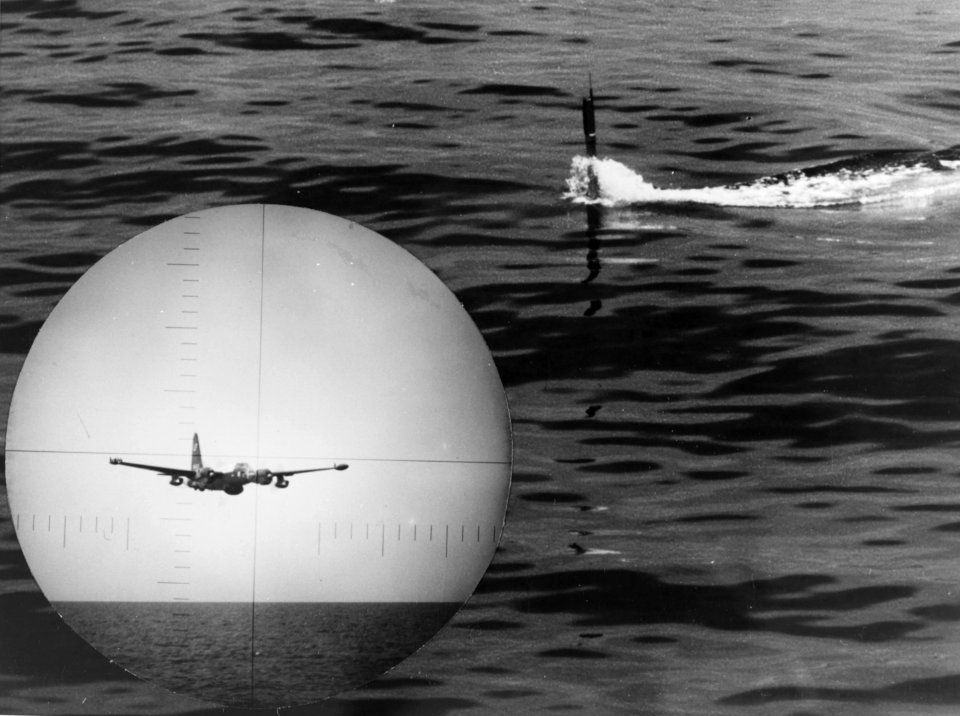 Periscope of USS Bluegill (AGSS-242) with a P-2 Neptune in flight (USN 1143148)