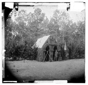 Petersburg, Virginia. Col. Ira Spaulding's quarters. Camp of the 50th New York Engineer. Pine boughs at front entrance-winter quarters LOC cwpb.01315
