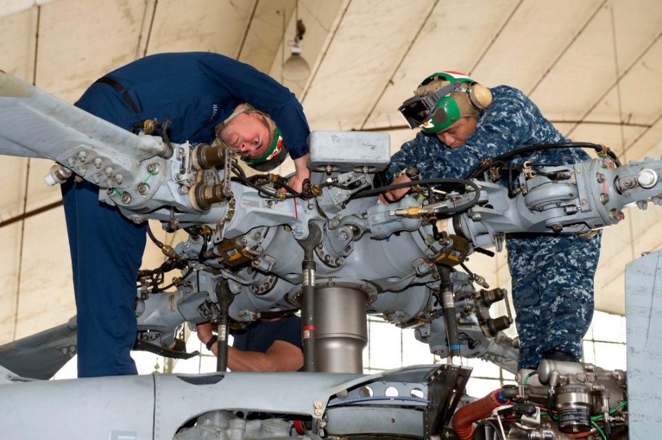 Performing maintenance 140210-N-TW634-029