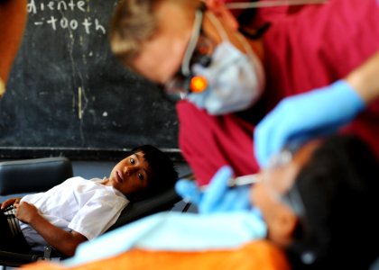 Peruvian awaits dental procedure by Navy dentist. (5690529476)