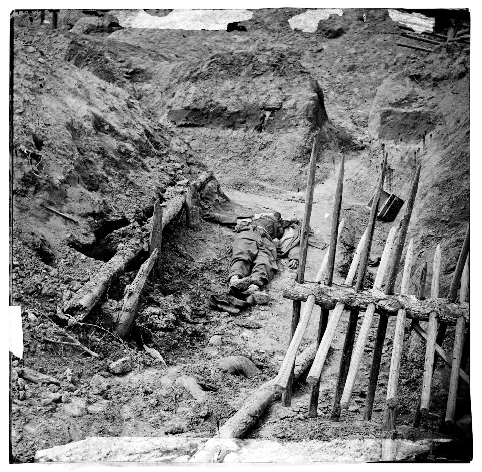 Petersburg, Va. Dead Confederate soldier, in trench beyond a section of chevaux-de-frise LOC cwpb.02555
