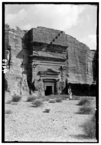 Petra (Wadi Musa) El-M'esrah area. Typical double corniced tomb. With pilasters, Nabatean capitals and pedimented doorway of classical conception. El-M'esrah LOC matpc.00248