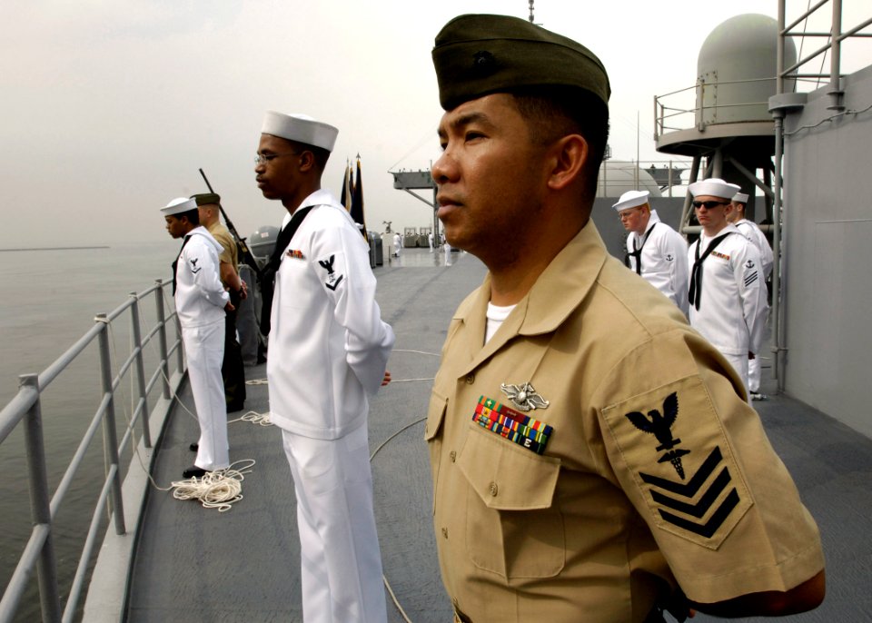Personnel man the rails on USS Blue Ridge (LCC 19)