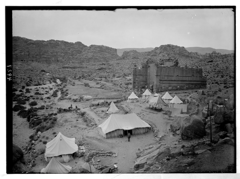 Petra (Wadi Musa). El-Habis area. Qasr Bint Far'on. A Roman temple; the only masonry monument left in Petra. Cook's camp in foreground LOC matpc.03103