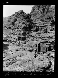 Petra. El-Habis area. El-Habis and opening of es-Siyyagh valley from el-M'esrah, showing rock walls of el-Biyara looming high in background LOC matpc.16277