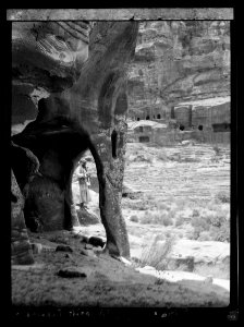 Petra. Theatre and el-Khubta area. The theatre from opposite cave, with large pillar formed by erosion LOC matpc.16272