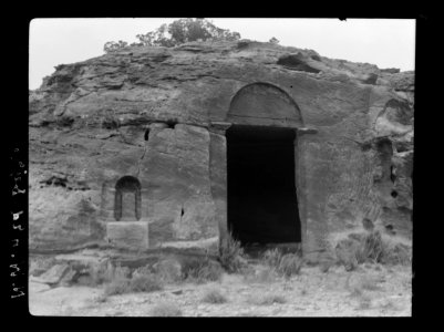 Petra. Wadi-Ed-Der. Archetype doorway near ed-Der. Dushara pillar in niche to left of doorway LOC matpc.16288
