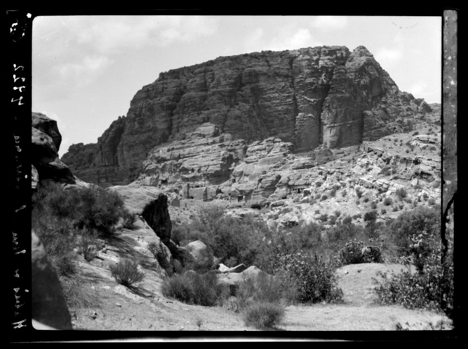 Petra. El-Habis area. El-Habis and Umm el-Biyara. A unique view showing el-Habis standing out in high light against the dark shadow on el-Biyara LOC matpc.16276