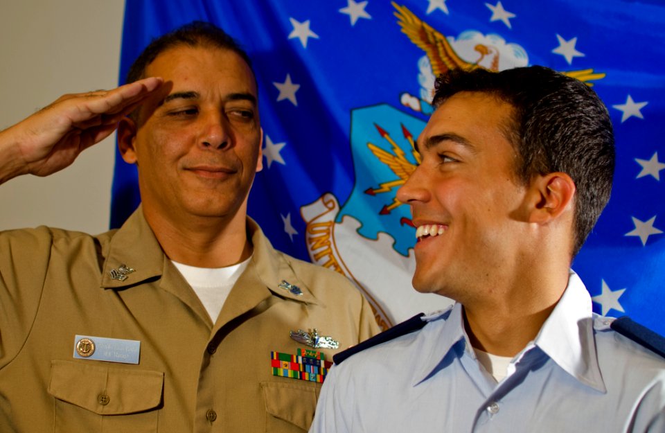 Petty Officer salutes newly commissioned Air Force son 110614-N-WP746-002