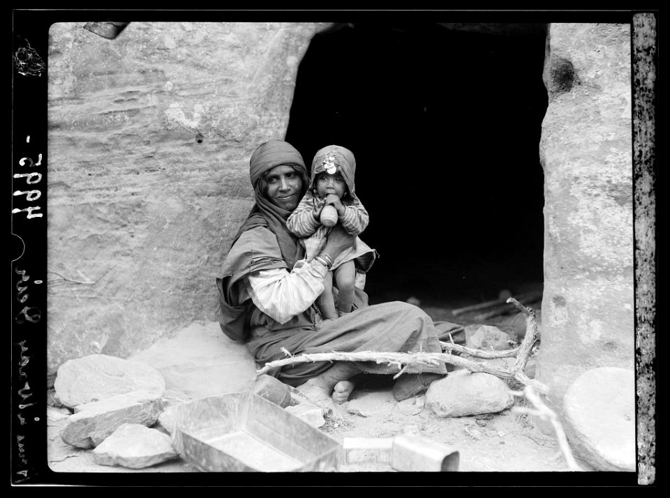 Petra. Petrean types, etc. Bdul Bedouins. Mother and baby before their cave home in ed-Dêr Valley LOC matpc.16305