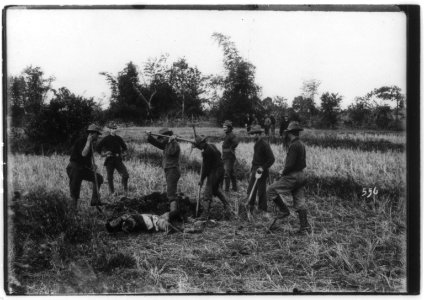 Philippine insurrection)- Burial of the enemy LCCN2002724008