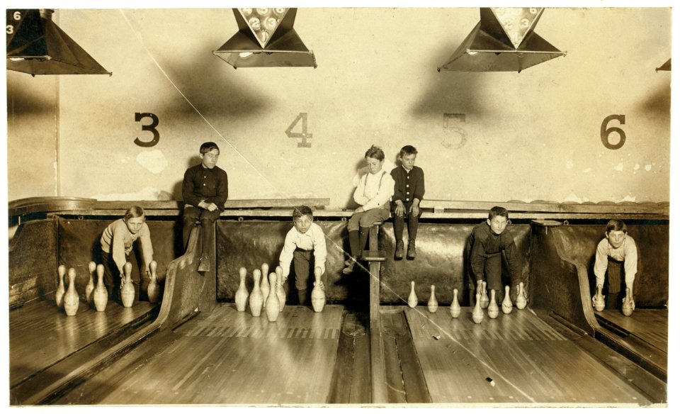 Photo of boys working in Arcade Bowling Alley, Trenton, N.J. Photo taken late at night. The boys work until midnight and later. I found practically no small boys selling late in the evening LOC nclc.03368