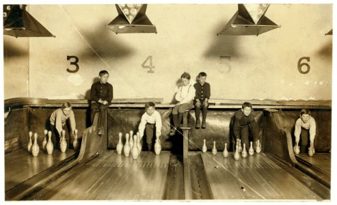 Photo of boys working in Arcade Bowling Alley, Trenton, N.J. Photo taken late at night. The boys work until midnight and later. I found practically no small boys selling late in the evening LOC nclc.03368