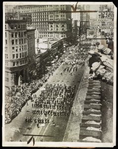 Photo shows general view of the Preparedness Day parade at San Francisco in 1916 looking down Mark Street toward the Ferry Building Tom Mooney and wife are shown in picture on roof top LCCN2016651585