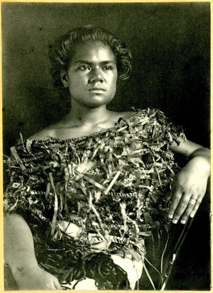 Photograph (black and white); portrait of woman sitting on a western-style chair, wearing a plant fibre top; Oceania. Gelatin silver print. Oc,B48.2, British Museum