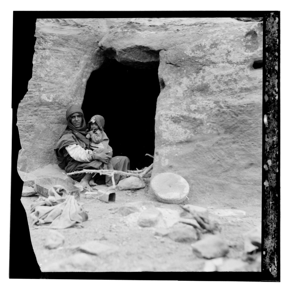 Petrean types, etc. Petra. Bdul troglodyte Arabs. Mother and baby before their cave home in ed-Der Valley LOC matpc.12381