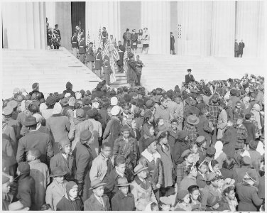 Photograph of a large group of black children at the Lincoln Memorial, during a commemoration of Lincoln's Birthday. - NARA - 199489
