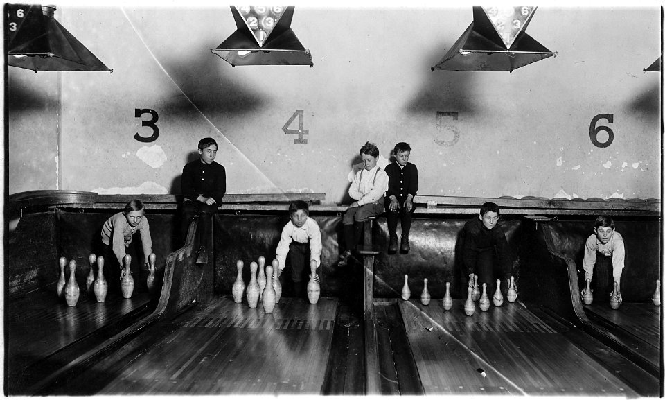 Photo of boys working in Arcade Bowling Alley. Photo taken late at night. The boys work until midnight and later.... - NARA - 523246