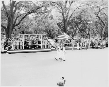 Photograph of a color guard passing the reviewing stand during the Armed Forces Day parade, as President Truman... - NARA - 200223