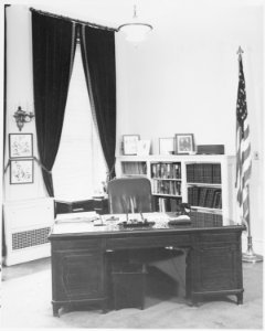 Photograph of a desk in the Executive Office of the President at the White House. - NARA - 199446