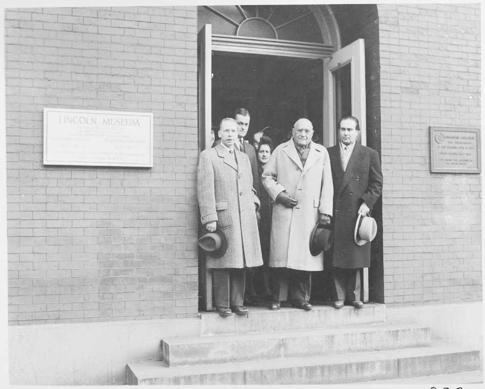 Photograph of a group of unidentified dignitaries in the doorway of the Lincoln Museum at Ford's Theater in... - NARA - 199494