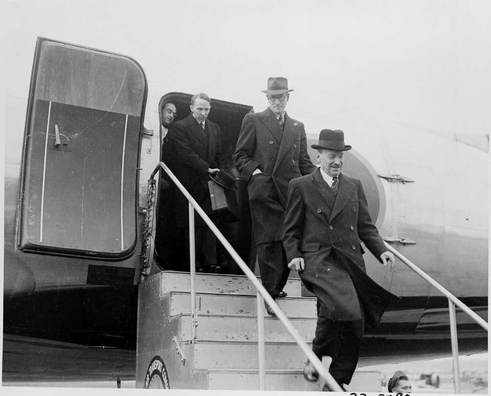 Photograph of British Prime Minister Clement Attlee disembarking from his aircraft upon his arrival at National... - NARA - 199244