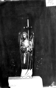 Photograph of a statue of an angel holding a candelabra Cuypershuis 0689c (04)