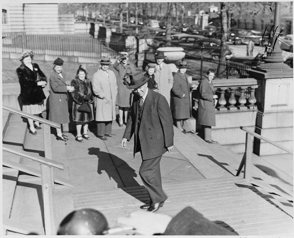 Photograph of George C. Marshall walking in Washington on the day he assumed the office of Secretary of State. - NARA - 199516