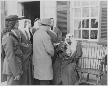 Photograph of Crown Prince Amir Saud of Saudi Arabia speaking into a microphone on the porch of George Washington's... - NARA - 199525