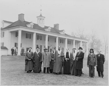 Photograph of Crown Prince Amir Saud of Saudi Arabia, with other dignitaries, outside George Washington's house at... - NARA - 199529