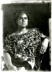Photograph (black and white); portrait of woman sitting on a western-style chair, wearing a plant fibre top; Oceania. Gelatin silver print. Oc,B130.62, British Museum