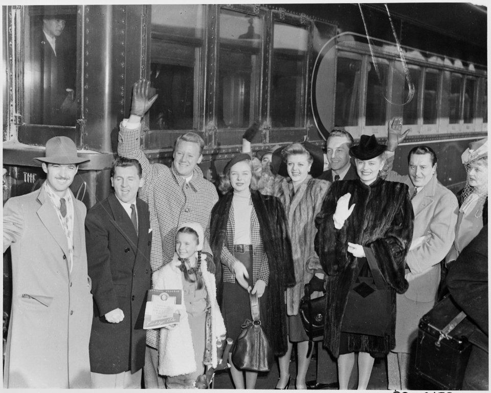 Photograph of movie stars arriving in Washington to participate in Roosevelt Birthday Ball activities, (from left to... - NARA - 199328