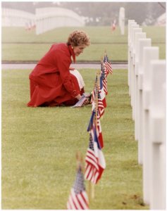 Photograph of Mrs. Reagan laying flowers at the Omaha Beach Memorial Cemetery, Normandy, France - NARA - 198532