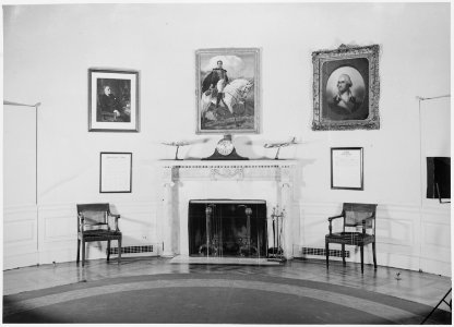 Photograph of fireplace and furniture in President Truman's Oval Office at the White House, with a portrait of Simon... - NARA - 199455 photo