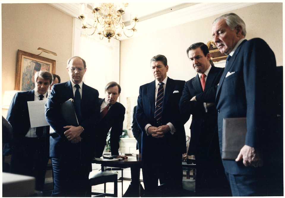 Photograph of President Reagan and his staff watching a televised replay of the Space Shuttle Challenger explosion - NARA - 198572