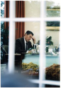 Photograph of President Reagan as he drafts his speech to the Nation on Lebanon and Grenada - NARA - 198540
