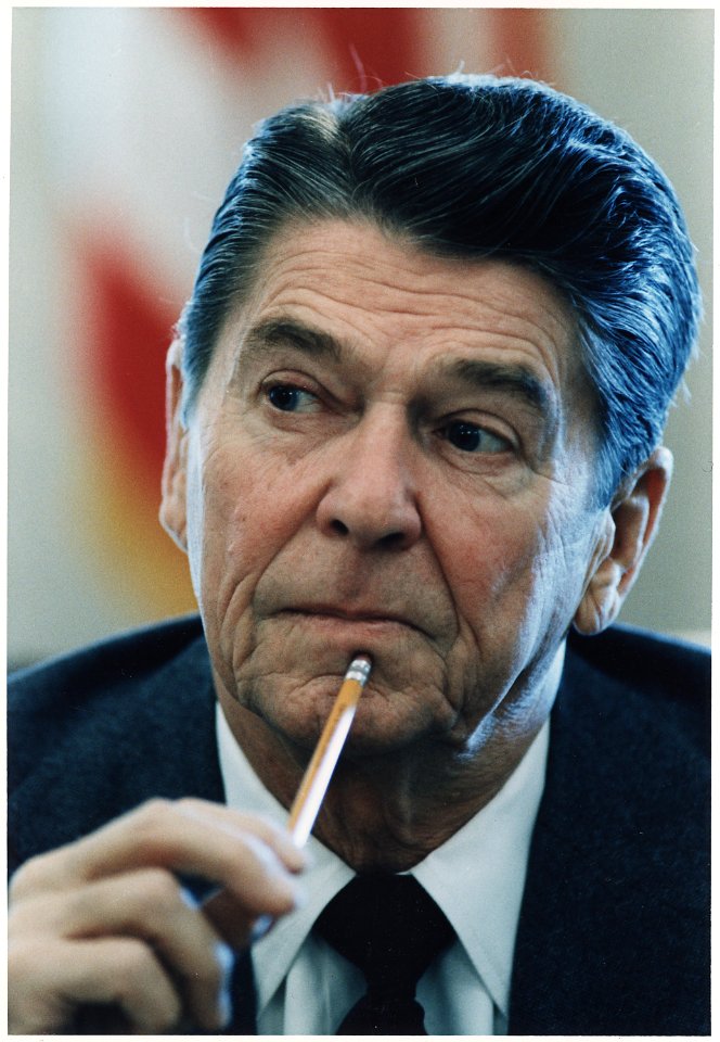 Photograph of Head Shot of President Reagan at a cabinet room meeting - NARA - 198541